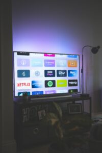 Multiple streaming service apps displayed on a large smart TV screen in 2026