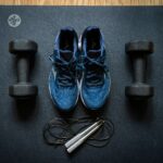 Best home gym equipment including dumbbells and smart fitness devices in a modern home gym in 2026