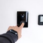 Smart thermostat with digital display mounted on a white wall in a modern home in 2026