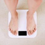 Best smart scale on a bathroom floor showing body composition metrics in 2026