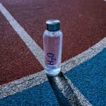 Best smart water bottle sitting next to gym equipment during a workout in 2026