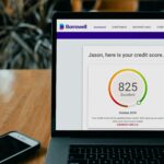 Best credit monitoring service displaying a credit score dashboard on a laptop screen in 2026
