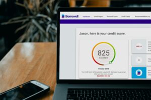 Best credit monitoring service displaying a credit score dashboard on a laptop screen in 2026