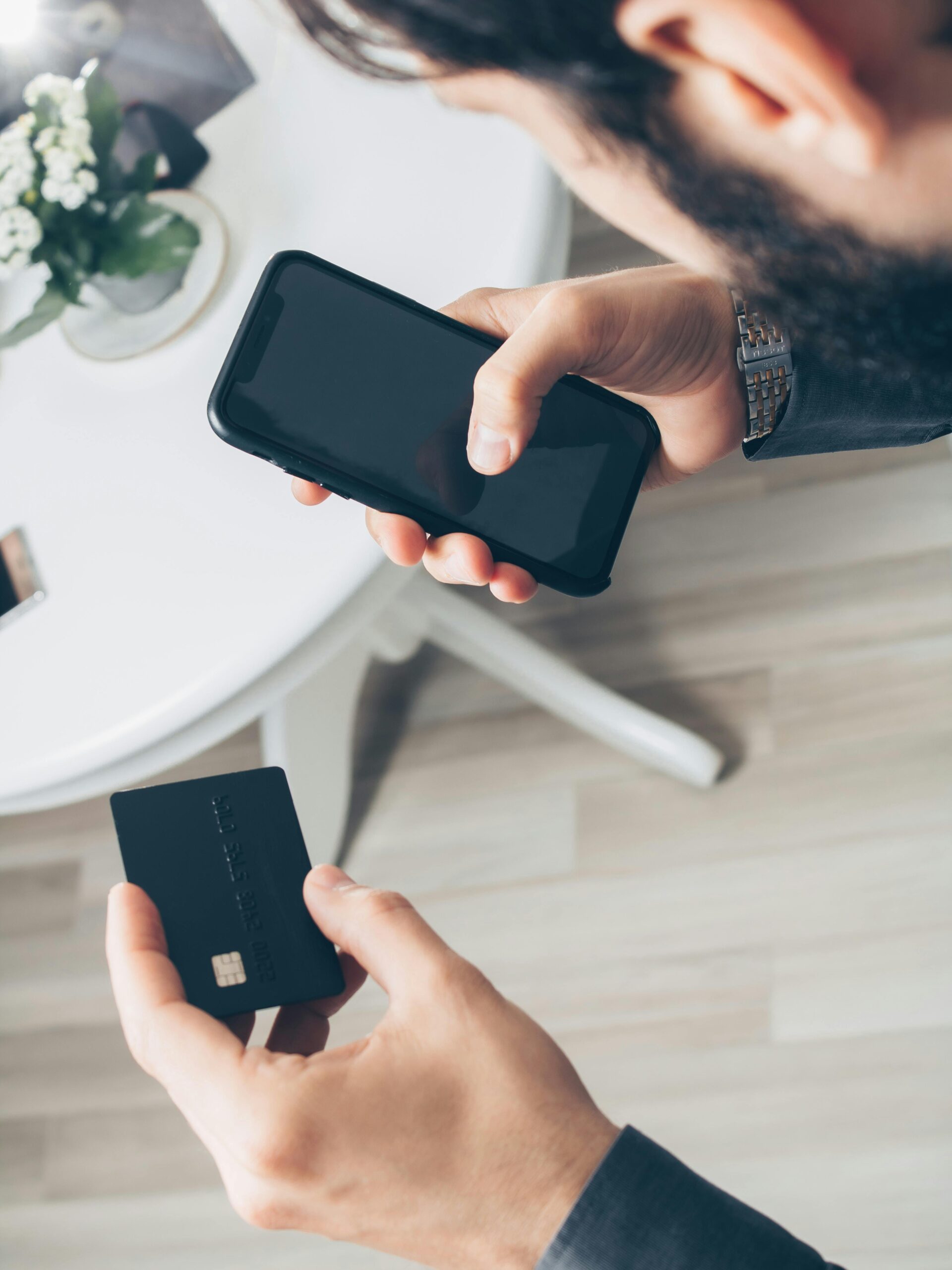 Person using Revolut digital bank app on smartphone for international payments and currency exchange